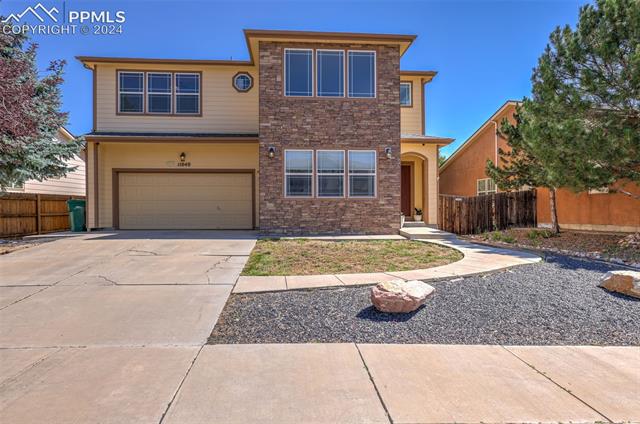 11040 Falling Star Road Fountain, CO 80817 - Photo 2 of 50 View of front facade featuring a garage