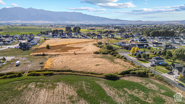294 West 3400 South, Unit 9 Logan, UT 84321 - Photo 13 of 24 Aerial view of residential area with mountains