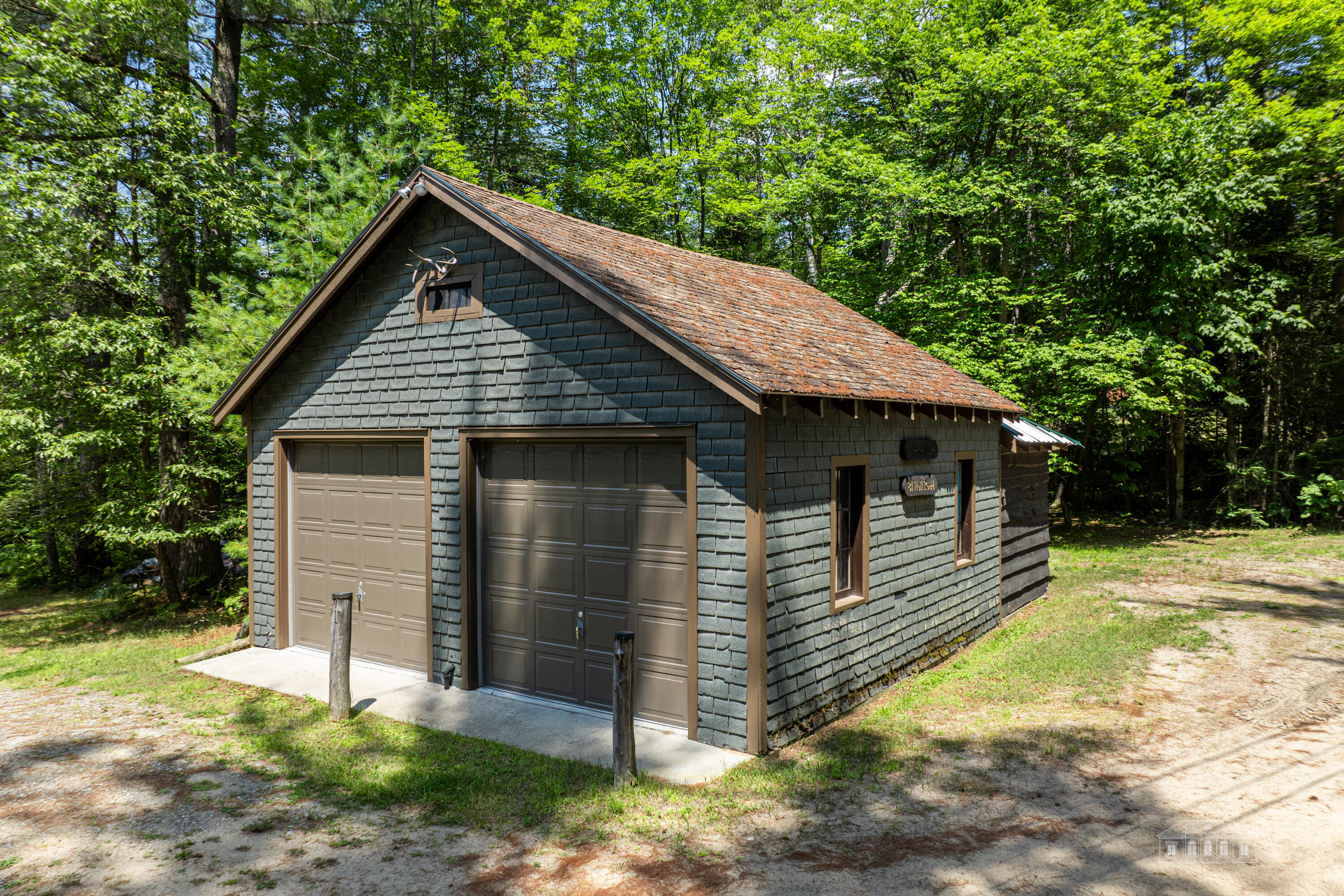 81 Hull Road Rainbow Lake, NY 12976 - Photo 48 of 62 Two car garage with storage shed