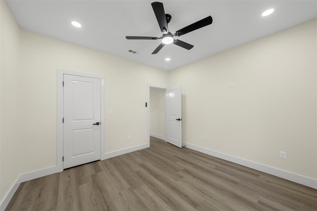3320 North 27th Street Waco, TX 76708 - Photo 27 of 38 an empty room with wooden floor and windows