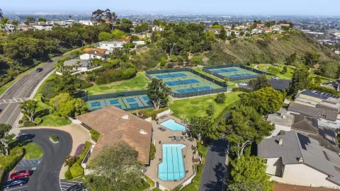 an aerial view of a house with a yard and a garage