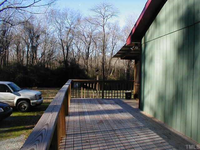 263 Pea Ridge Road New Hill, NC 27562 - Photo 7 of 7 a view of balcony with two chairs