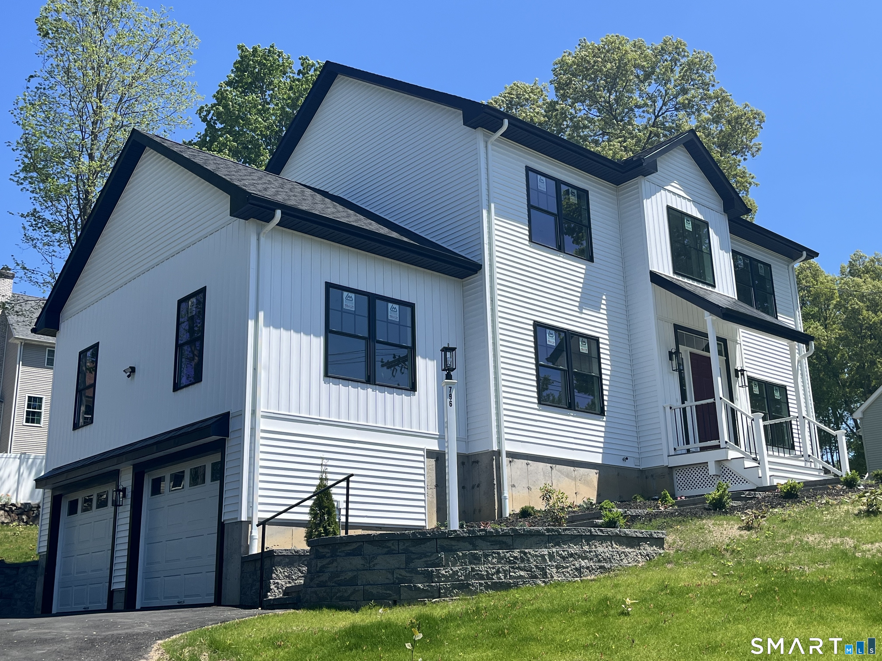 796 Maple Hill Road Naugatuck, CT 06770 - Photo 31 of 35 a house that has a lot of windows in it