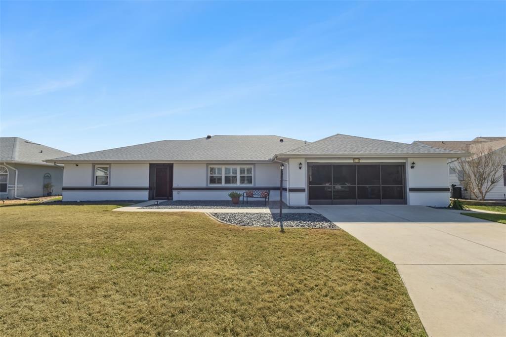 a swimming pool view with a outdoor seating space