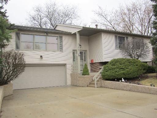 355 Red Bridge Road Lake Zurich, IL 60047 - Photo 1 of 1 a front view of a house with a garage