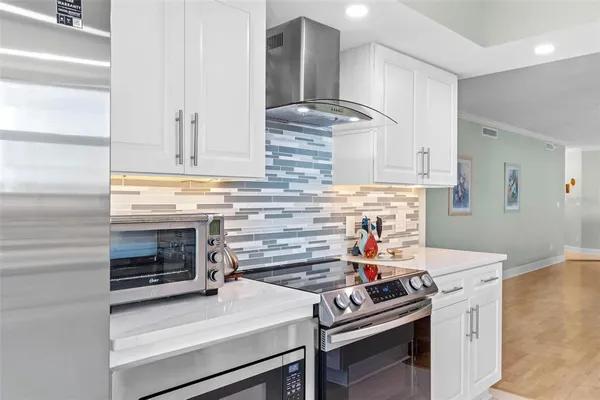 a view of a city from a dining room with furniture window and wooden floor