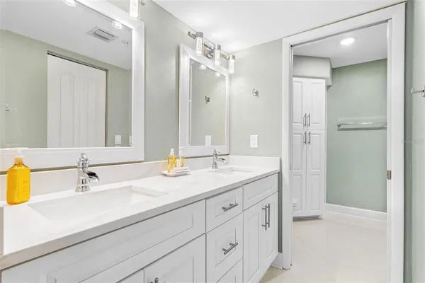 a bathroom with a shower and a glass door