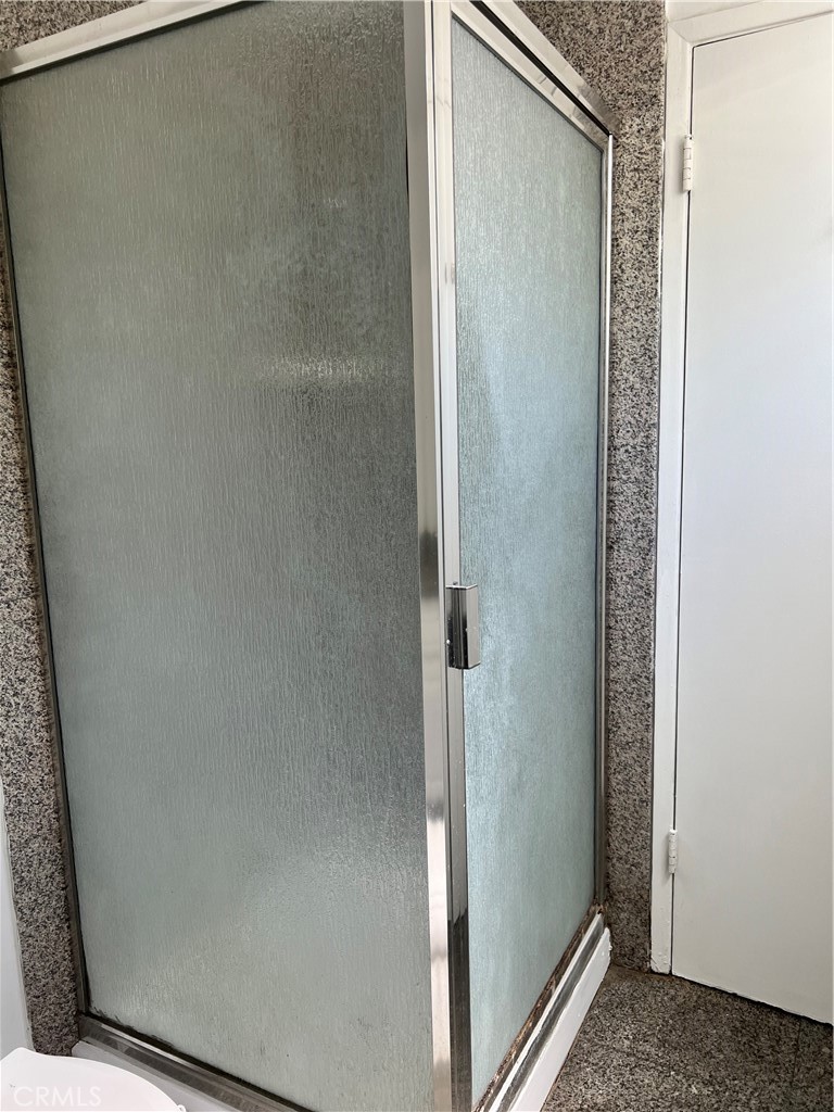 4731 Helmgate Drive El Monte, CA 91732 - Photo 12 of 30 a bathroom with a glass shower door