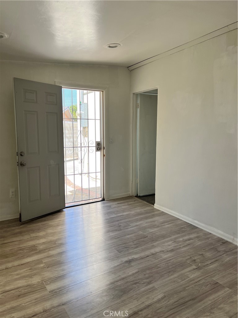 4731 Helmgate Drive El Monte, CA 91732 - Photo 15 of 30 a view of an empty room with wooden floor and a window