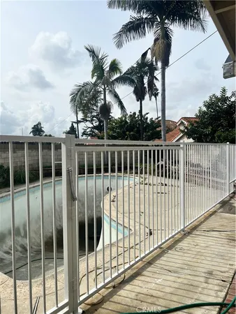 a view of balcony with a yard