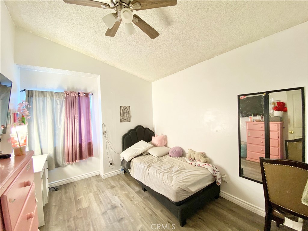 1444 North Sage Avenue Rialto, CA 92376 - Photo 19 of 22 a bedroom with a bed and window