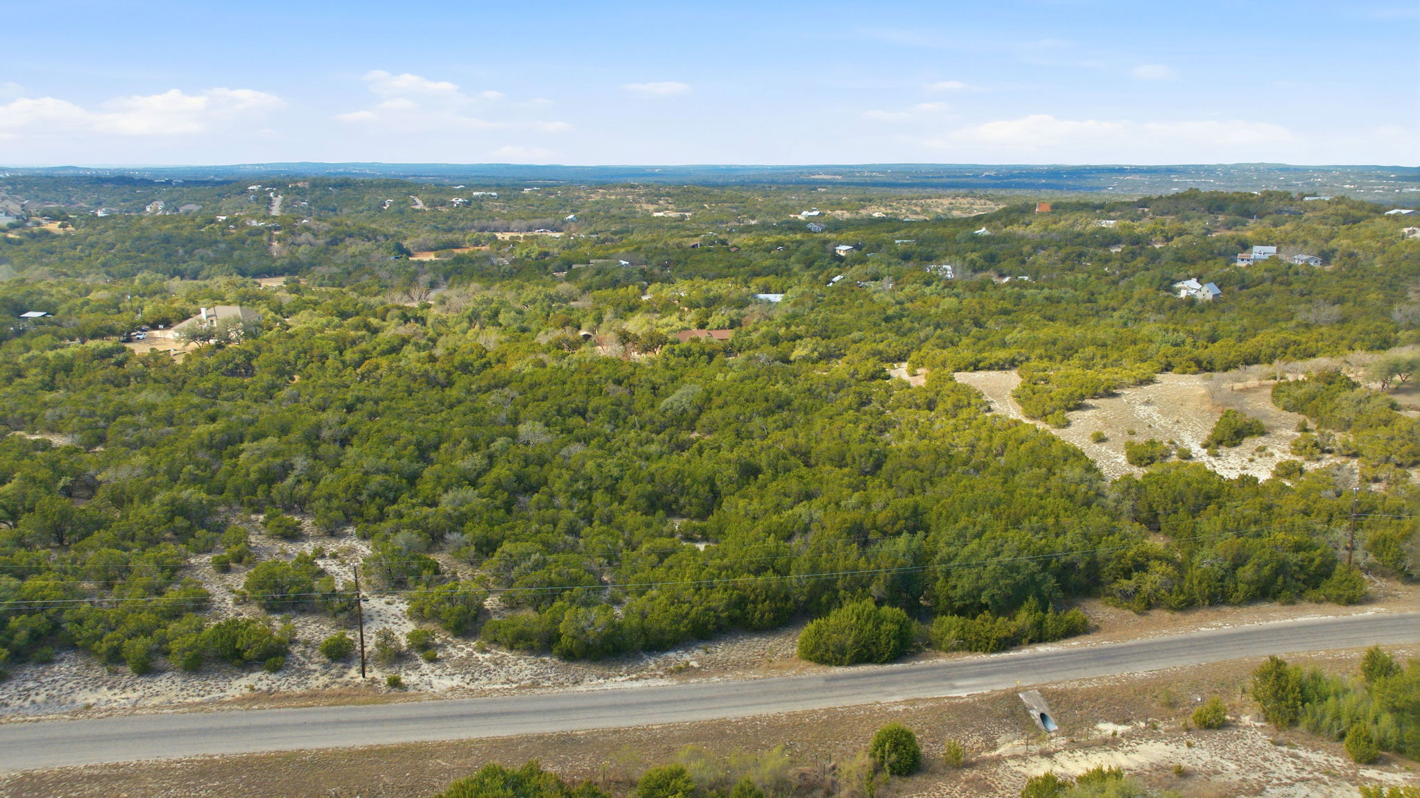 400 Sundown Ridge Austin, TX 78737 - Photo 19 of 21 Aerial view of property's location with a heavily wooded area