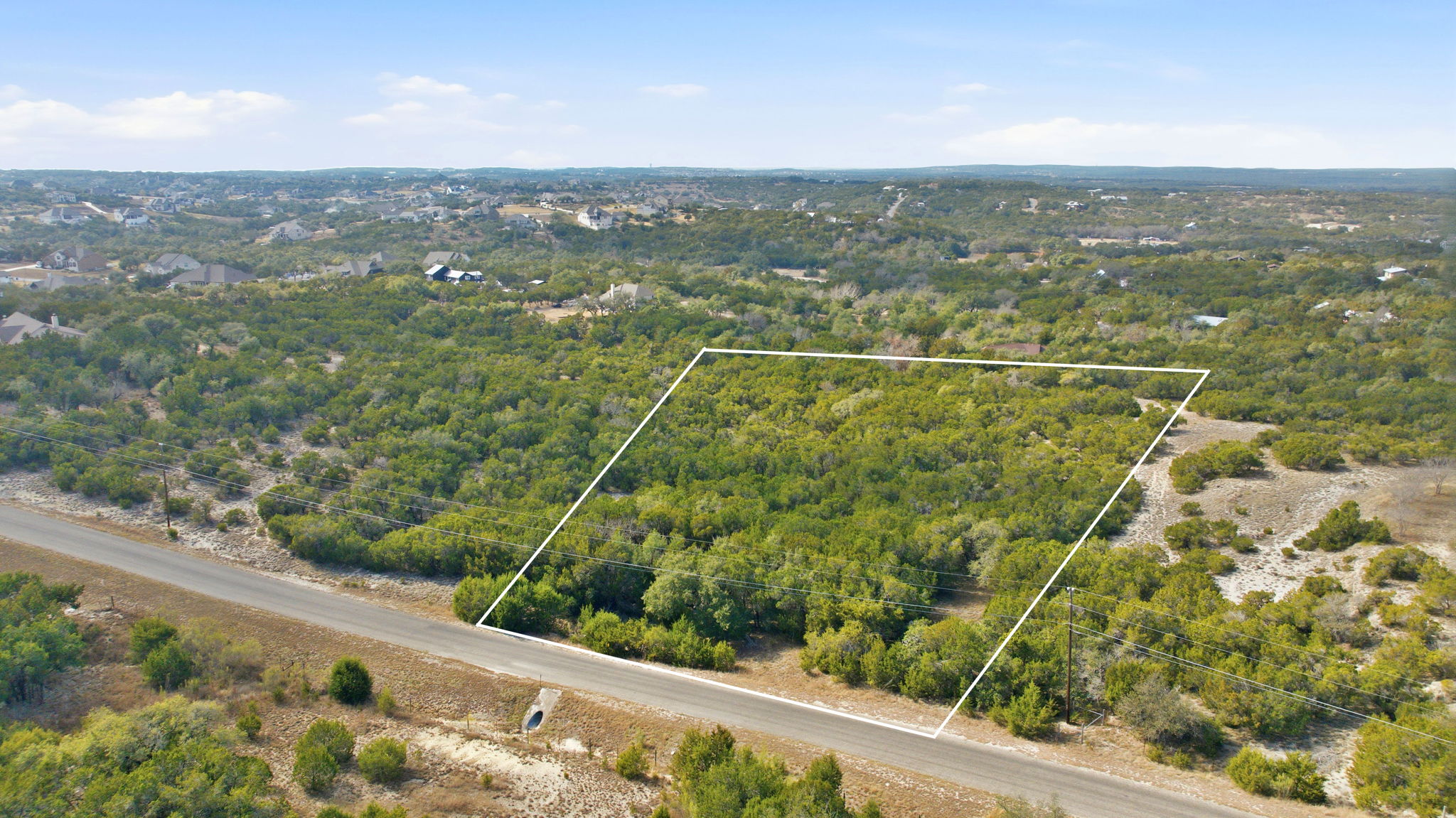 400 Sundown Ridge Austin, TX 78737 - Photo 7 of 21 Aerial view of property and surrounding area featuring property parcel outlined