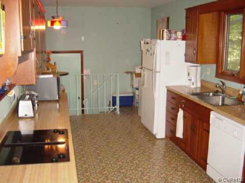 3914 Timber Ridge Road Midlothian, VA 23112 - Photo 2 of 10 a kitchen with refrigerator a stove a sink and a refrigerator