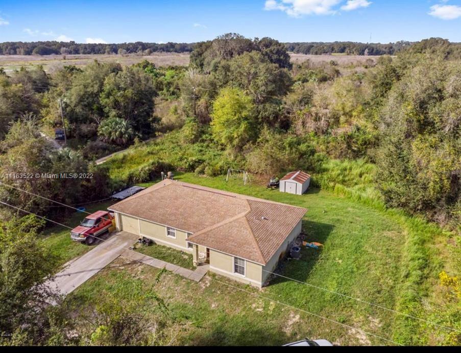 15280 Northeast 34th Terrace Citra, FL 32113 - Photo 1 of 37 an aerial view of a house with a yard