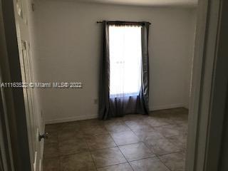 15280 Northeast 34th Terrace Citra, FL 32113 - Photo 14 of 37 a view of an empty room with a window