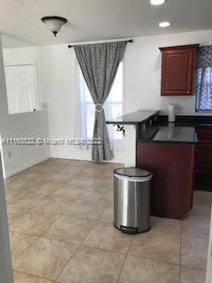 15280 Northeast 34th Terrace Citra, FL 32113 - Photo 19 of 37 a room with a stove a sink and a cabinets