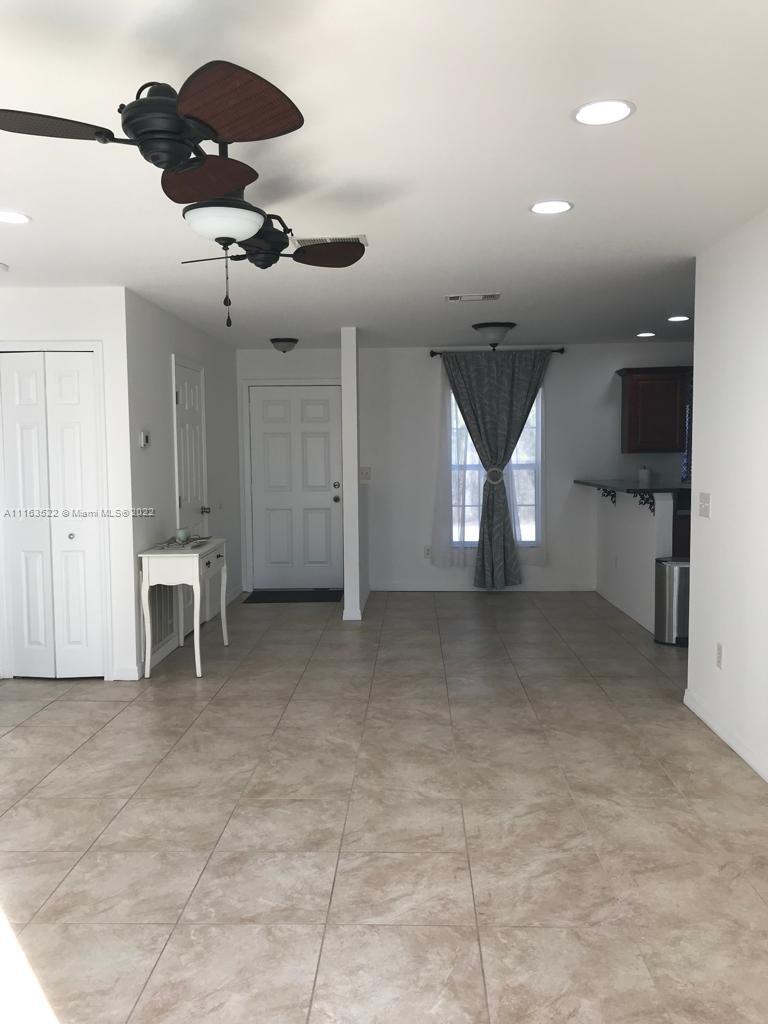 15280 Northeast 34th Terrace Citra, FL 32113 - Photo 22 of 37 a view of a livingroom with furniture and a ceiling fan