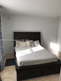15280 Northeast 34th Terrace Citra, FL 32113 - Photo 26 of 37 a bedroom with a bed and window