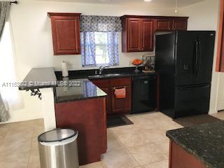 15280 Northeast 34th Terrace Citra, FL 32113 - Photo 3 of 37 a kitchen with stainless steel appliances granite countertop a refrigerator a stove a sink and a cabinets