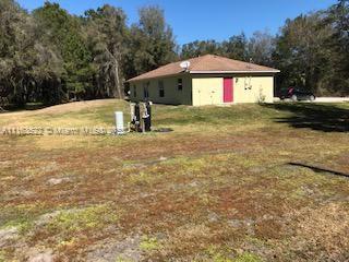 15280 Northeast 34th Terrace Citra, FL 32113 - Photo 37 of 37 a front view of a house with a yard