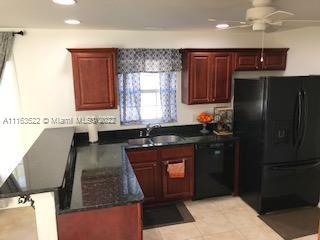 15280 Northeast 34th Terrace Citra, FL 32113 - Photo 4 of 37 a kitchen with a refrigerator and a sink