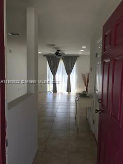 15280 Northeast 34th Terrace Citra, FL 32113 - Photo 8 of 37 a view of a hall with wooden floor