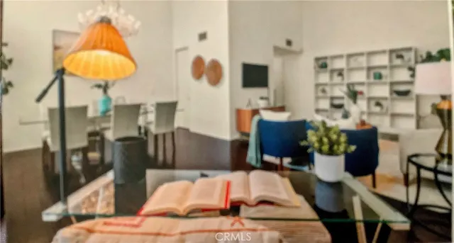 a living room with furniture and a lamp