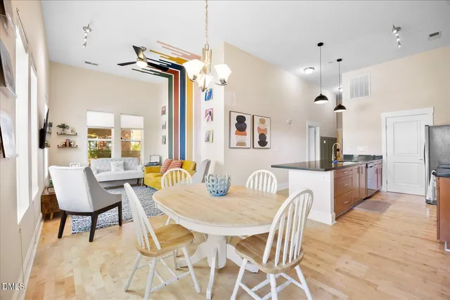 a view of a dining room with furniture and wooden floor
