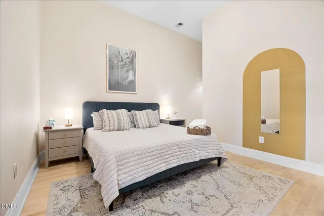 a bedroom with a bed and a dresser