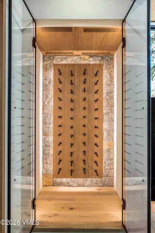 a living room with furniture fireplace and a large window
