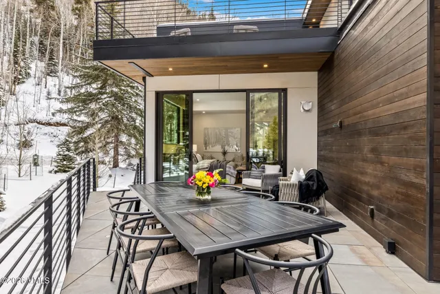 a bedroom with a large bed and a fireplace