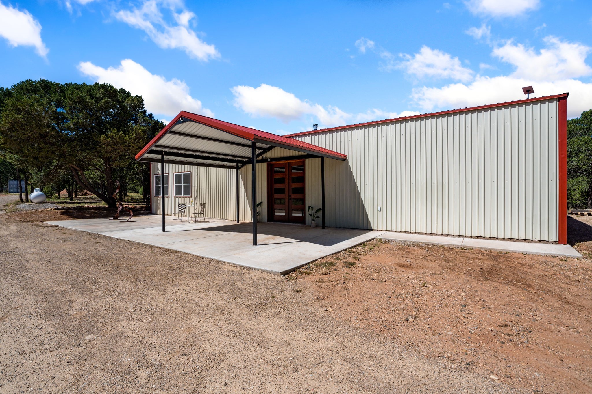 11 Blue Jay Way Rowe, NM 87562 - Photo 2 of 36 Front of home from side