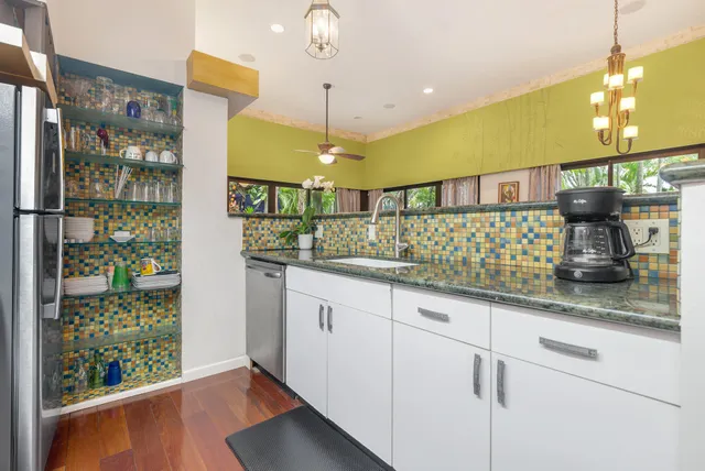 a bedroom with a bed and a large mirror