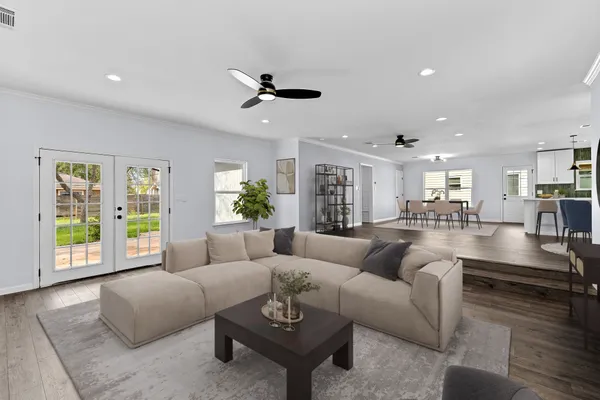 a living room with furniture and a large window