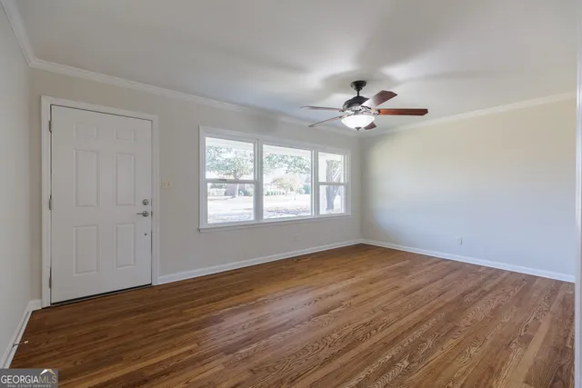 a view of an empty room with a window