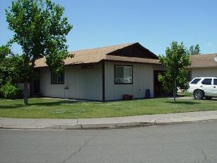 20694 Roff Way Burney, CA 96013 - Photo 2 of 2 a white house that has a tree in front of it