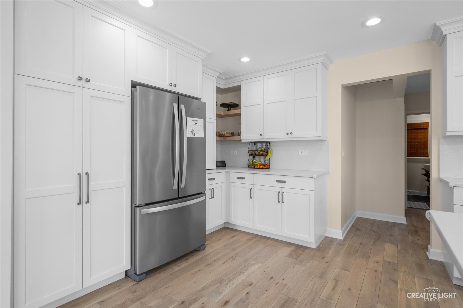 440 Willow Road New Lenox, IL 60451 - Photo 11 of 45 a kitchen with white cabinets and stainless steel appliances