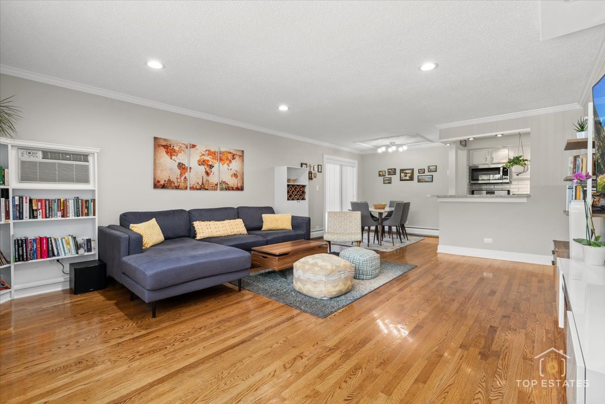 1227 South Old Wilke Road, Unit 201 Rolling Meadows, IL 60005 - Photo 12 of 40 a living room with furniture and a wooden floor