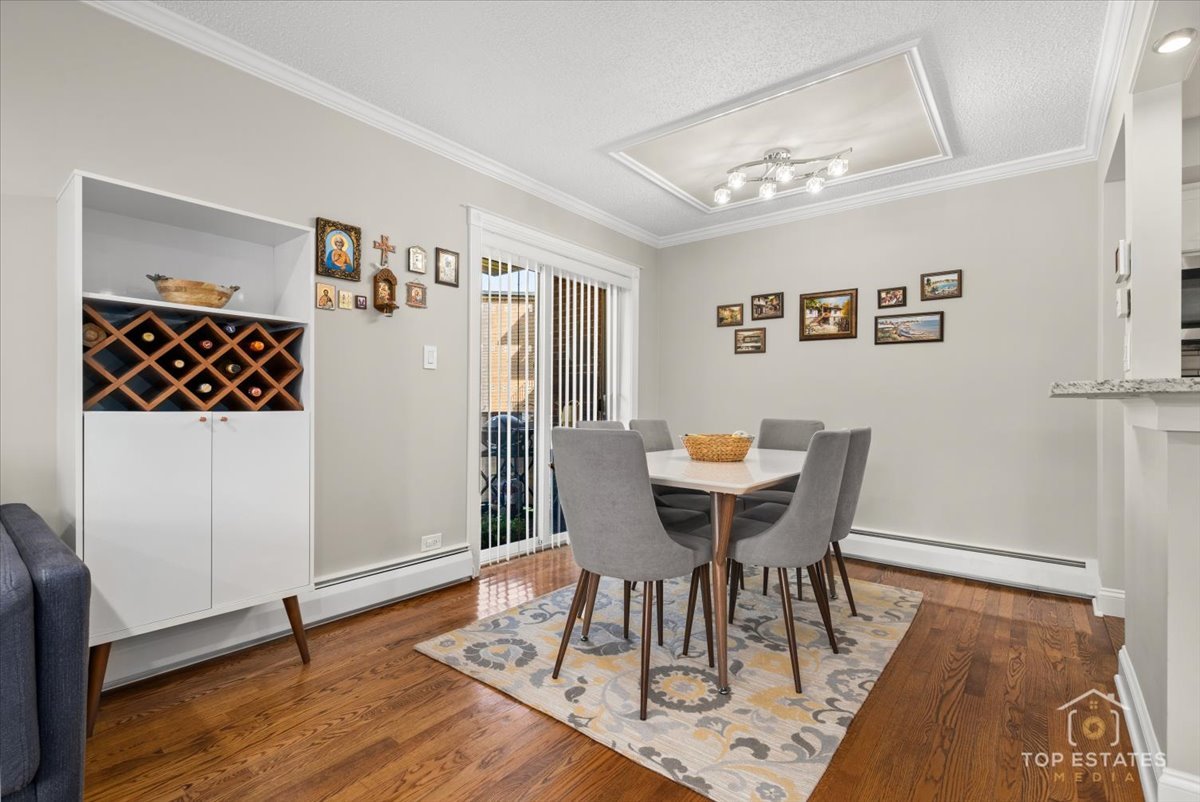 1227 South Old Wilke Road, Unit 201 Rolling Meadows, IL 60005 - Photo 14 of 40 a view of a dining room with furniture and wooden floor