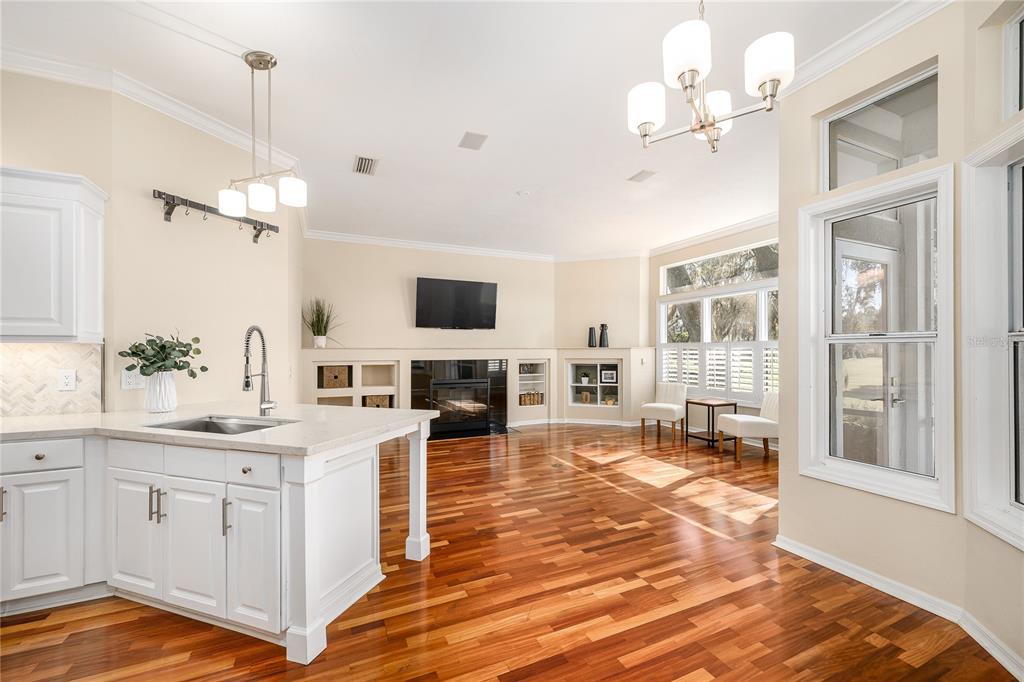 4417 Southwest 91st Drive Gainesville, FL 32608 - Photo 11 of 54 a kitchen with a sink stove and cabinets