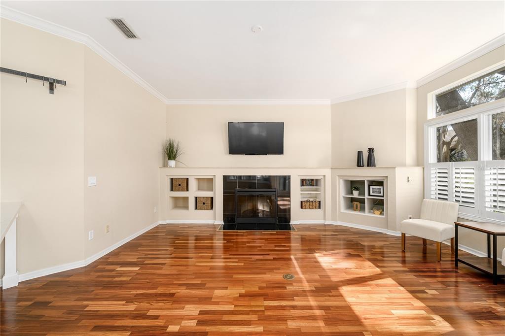 4417 Southwest 91st Drive Gainesville, FL 32608 - Photo 13 of 54 a living room with fireplace furniture and a flat screen tv