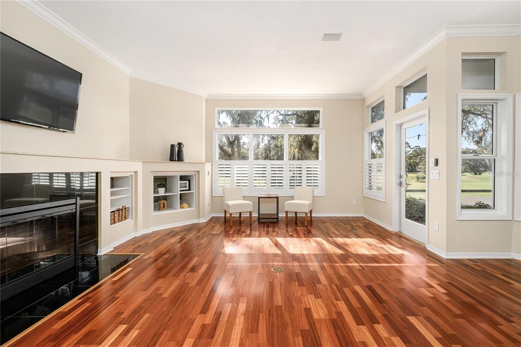 4417 Southwest 91st Drive Gainesville, FL 32608 - Photo 14 of 54 a living room with furniture and a flat screen tv