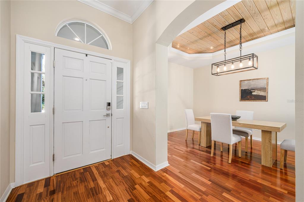 4417 Southwest 91st Drive Gainesville, FL 32608 - Photo 2 of 54 a view of a dining room with furniture window and wooden floor