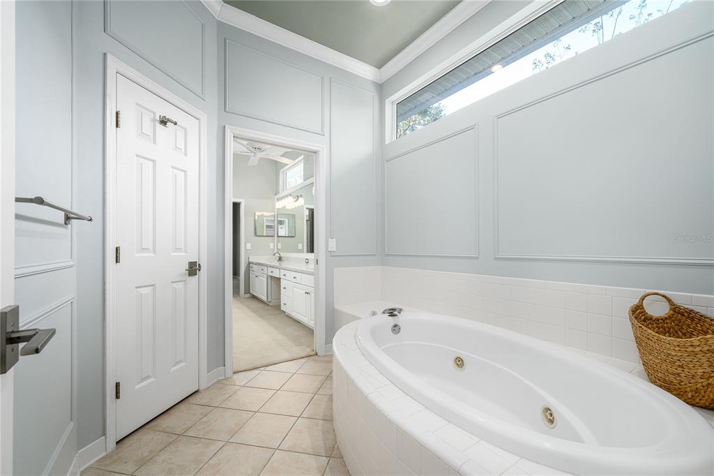 4417 Southwest 91st Drive Gainesville, FL 32608 - Photo 28 of 54 a bathroom with a tub shower and sink