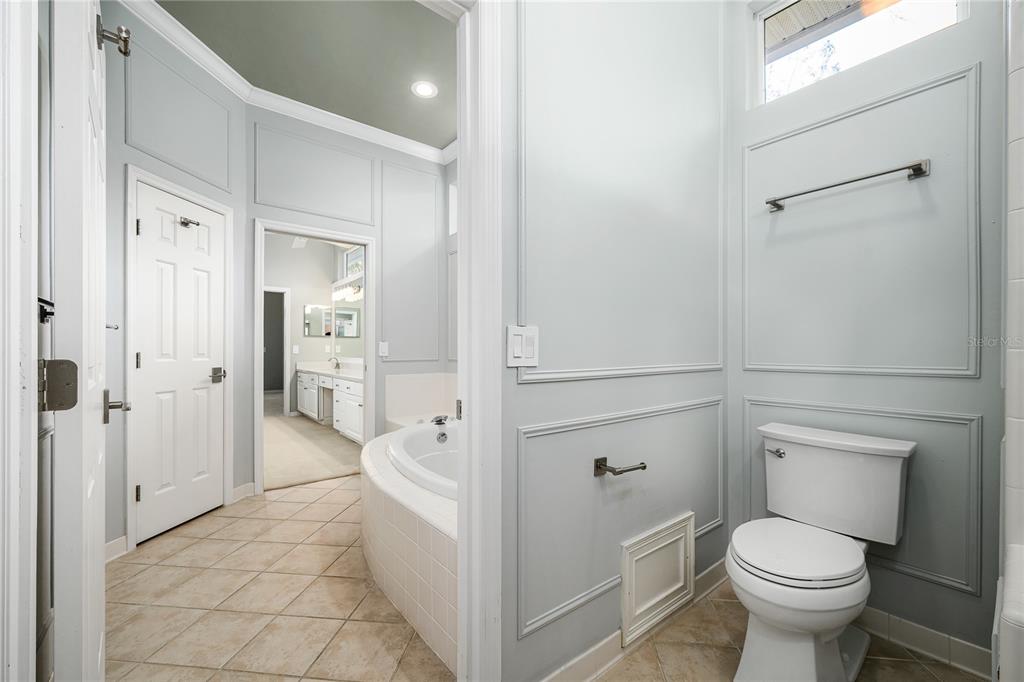 4417 Southwest 91st Drive Gainesville, FL 32608 - Photo 29 of 54 a bathroom with a toilet sink and shower