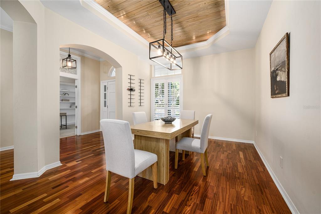 4417 Southwest 91st Drive Gainesville, FL 32608 - Photo 3 of 54 a view of a dining room with furniture window and wooden floor