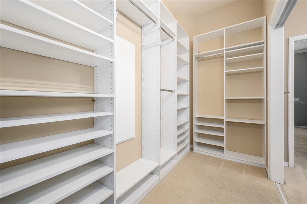 4417 Southwest 91st Drive Gainesville, FL 32608 - Photo 32 of 54 a view of walk in closet with empty racks