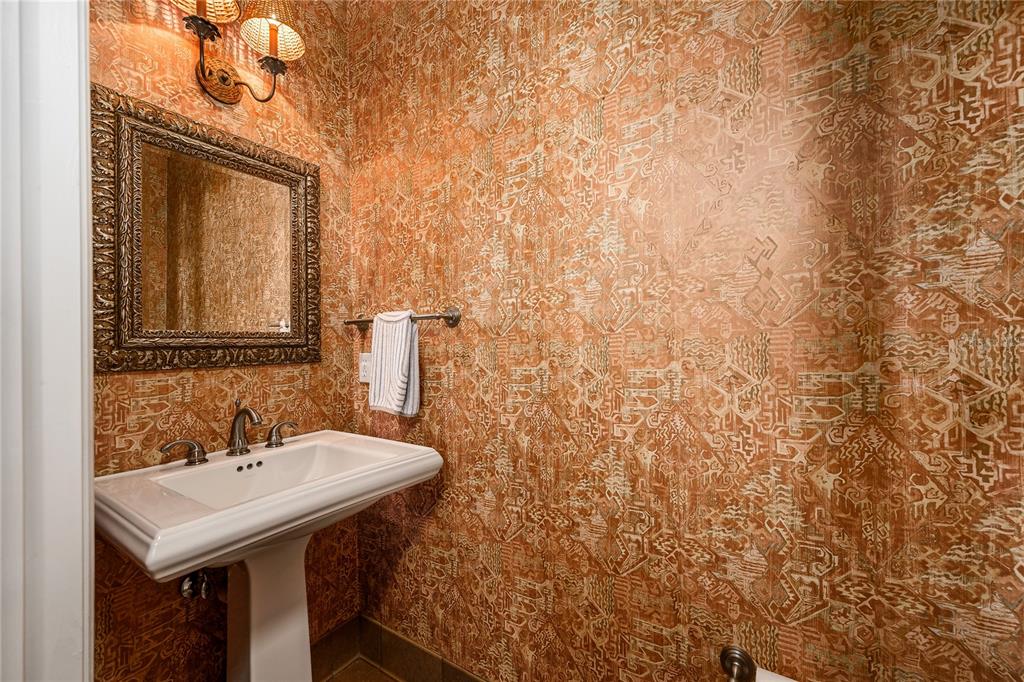 4417 Southwest 91st Drive Gainesville, FL 32608 - Photo 33 of 54 a bathroom with a sink and a mirror