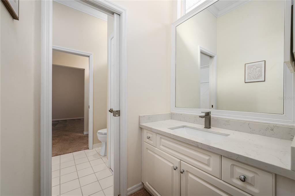 4417 Southwest 91st Drive Gainesville, FL 32608 - Photo 35 of 54 a bathroom with a sink and a mirror